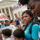 Families react to news on a Supreme Court decision blocking Obama’s immigration plan, which would have protected millions of immigrants from deportation, in front of the U.S. Supreme Court, on June 23, 2016 in Washington, DC.